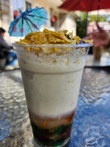 Layered dessert drink in a tall glass
